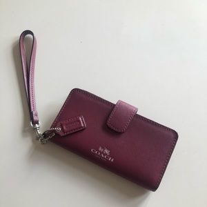 Wine colored Coach Wristlet